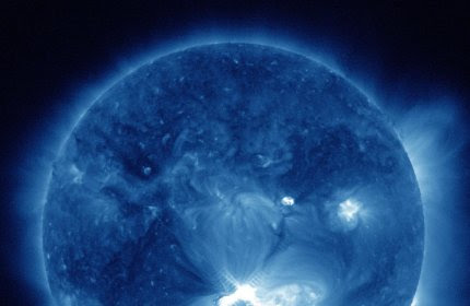 This false-color image provided by NASA shows a solar flare, lower center, erupting from the sun on Thursday, July 12, 2012. Space weather scientists said there should be little impact to Earth. The flare erupted from a region which rotated into view on July 6, 2012. (AP Photo/NASA)