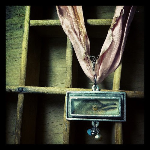 Resin charm w vintage illustration, on sari silk by KimWJenkins