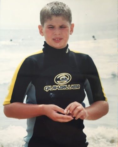 Young Ryan Johnson on the beach