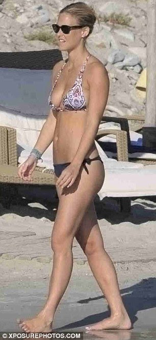 Just peachy! Bar Refaeli showed off her supermodel curves in a tiny two-piece as she holidayed on the Greek island of Mykonos