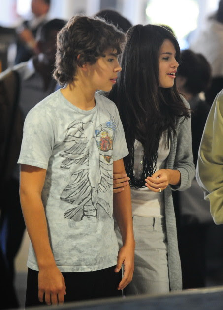 Selena Gomez And Co-Star Jake Austin Stay Close At LAX