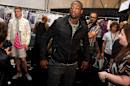 FILE - In this Sept. 8, 2011 file photo, Miami Heat basketball player Dwyane Wade visits backstage at the Richard Chai Spring 2012 fashion show during Mercedes-Benz Fashion Week in New York. The Miami Heat star says while he always was a fan of fine dressing, it wasn’t until the former commissioner of the league instituted a dress code that he started taking more interest in what he would wear off the court. Now Wade is considered among the more fashion-forward stars in a league where players dress to impress. (AP Photo/Charles Sykes, File)