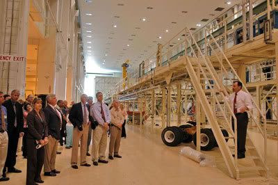 NASA officials take a tour of the Operations and Checkout Building at Florida's Kennedy Space Center.  The O&C will be the facility where the ORION spacecraft is assembled and tested before flight.