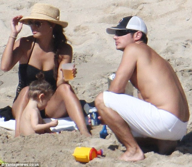 Lovely pair: Nick and Vanessa seemed to be having a great time relaxing on the beach