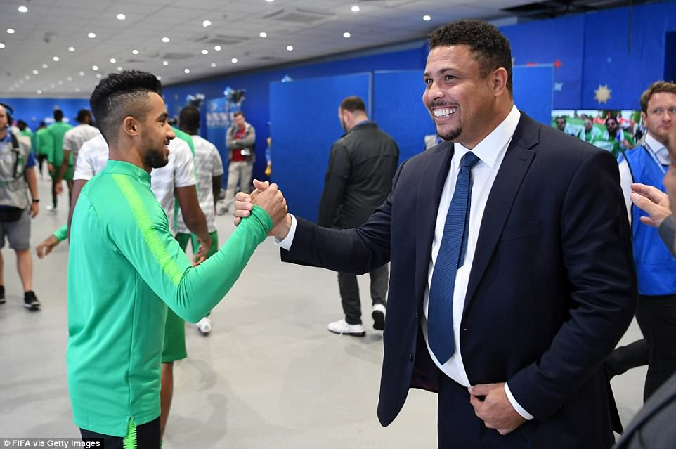 Brazilian icon Ronaldo shakes hands with Hatan Bahbir before striding out onto the pitch to start the ceremony