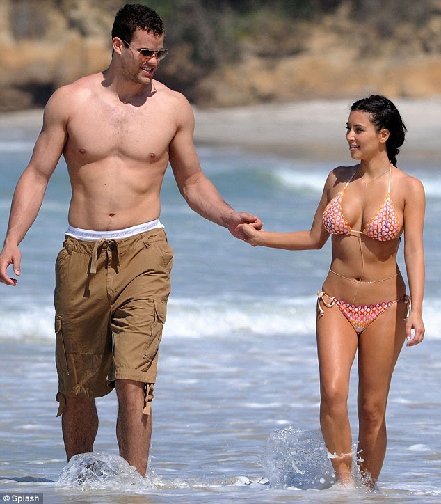 Little and large: The 6ft 9in basketball player towers over the 5ft 3in reality TV star