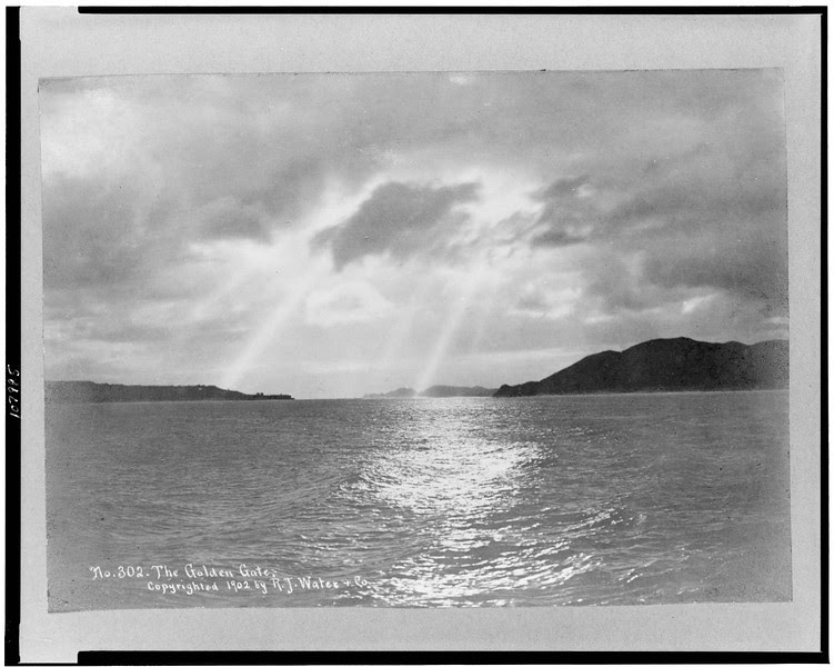 Description of  View of the San Francisco Bay before the Golden Gate Bridge was built with sun shining through clouds on water, c1902. (Library of Congress)