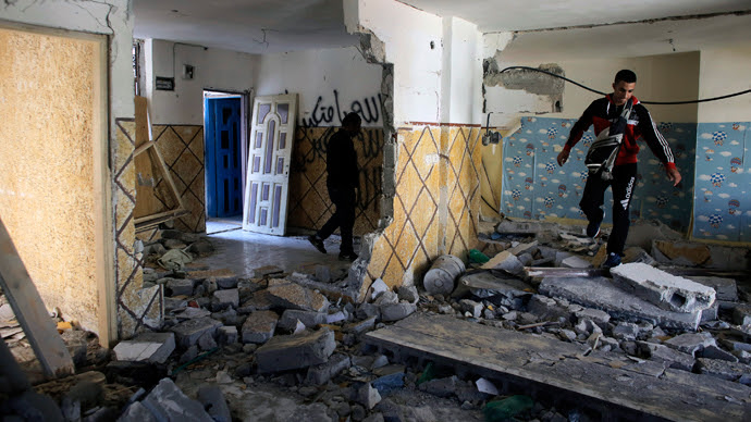 Relatives of Abdel-Rahman Shaloudi walk on rubble in his destroyed home in the East Jerusalem neighbourhood of Silwan November 19, 2014. (Reuters / Ammar Awad)