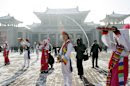 North Korean youths in traditional Korean outfit play instruments in front of the Pyongyang Grand Theatre in Pyongyang, North Korea, to celebrate a rocket launch on Wednesday, Dec. 12, 2012. North Korea appeared to successfully fire a long-range rocket Wednesday, defying international warnings as the regime of Kim Jong Un pushes forward with its quest to develop the technology needed to deliver a nuclear warhead. (AP Photo/Jon Chol Jin)