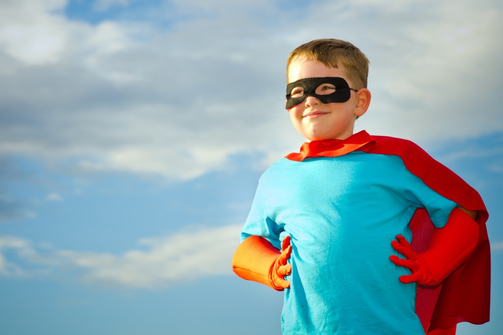 Child pretending to be a superhero