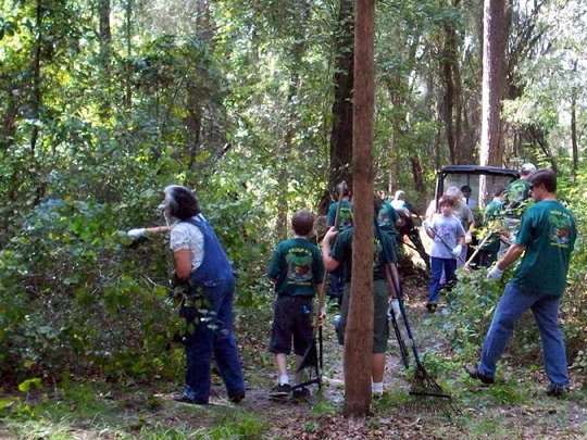 Volunteers clear trail.