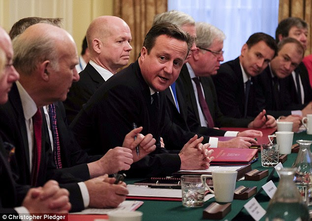 Keeping the crown: Goldman Sachs predicts that David Cameron, pictured at the first Cabinet meeting on Tuesday, will win the election thanks to strong economic growth and an improvement in household incomes