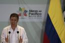 Colombia's President Juan Manuel Santos speaks after the signing of agreements at the second day of the 2014 Alianza del Pacifico political summit in Punta Mita