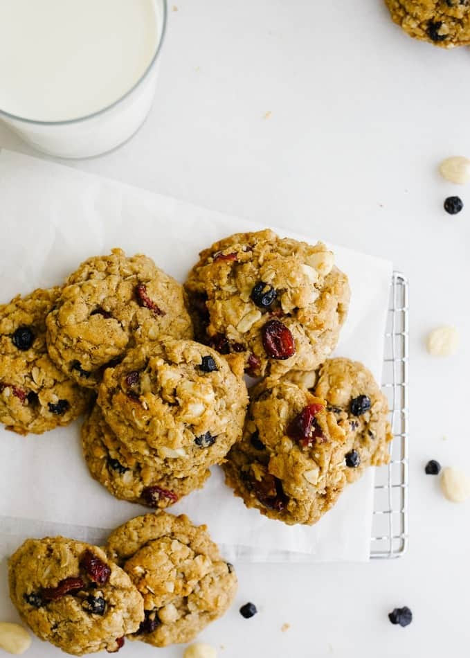 Vegan Oatmeal Cookies by Wood and Spoon. These are healthy vegetarian plant based cookies with coconut oil, flaxseed meal egg, dried fruit and nuts. Marcona almonds and dried cranberries and blueberries help to sweeten these brown sugar cookies and whole rolled oats keep them chewy. These stay soft for days and are flavored with cinnamon. Try this simple, one bowl healthy no butter less fat cookies for yourself and read more at thewoodandspoon.com