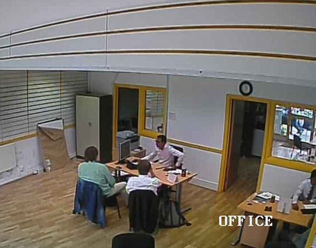 Our reporter, right, showed staff how their meeting was being shown live on the internet 