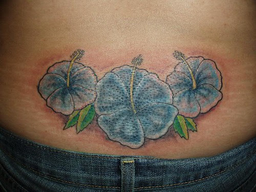 Blue Hibiscus cover up tattoo by jon poulson
