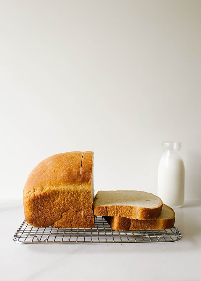 Buttermilk Bread Recipe by Wood and Spoon Blog. This is a fluffy tangy soft homemade bread recipe made without a bread maker. Buttermilk and all-purpose flour make up this mild sandwich bread that is simple for beginners and very few ingredients. You can knead by hand or using a dough hook of a stand mixer. Perfect for deli sandwiches or PB&J. Find the recipe and how to by Kate Wood on thewoodandspoon.com