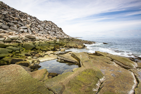 quarried rocks and ocean
