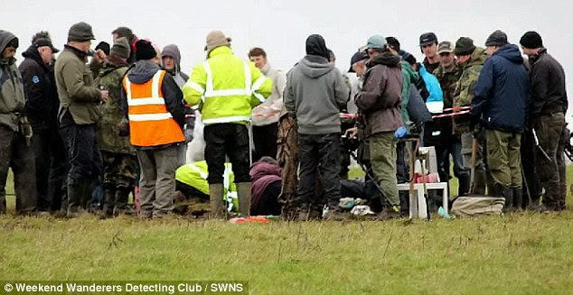 Gathered round: The club members awaiting the results of the find. A spokesman for the Buckinghamshire County Museum said: 'This is one of the largest hoards of Anglo Saxon coins ever found in Britain'