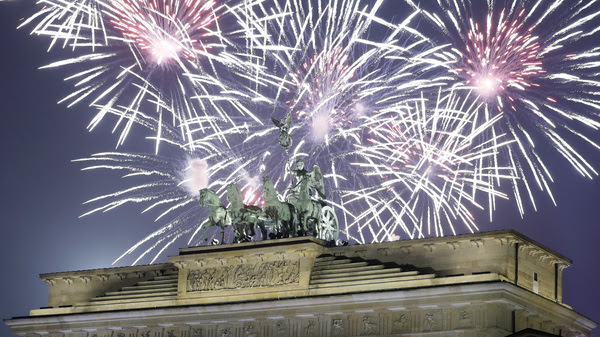 Fireworks light the sky above the Quadriga at the Brandenburg Gate shortly after midnight in Berlin, Germany, Sunday, Jan. 1, 2017.