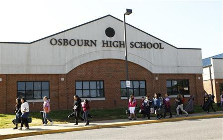 Students pass in front of Osbourn High School in Manassas, Virginia, April 25, 2012.REUTERS-Kevin Lamarque