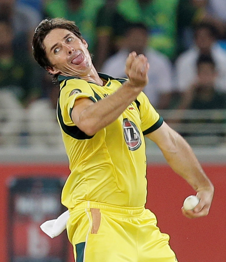 Brad Hogg runs in to bowl