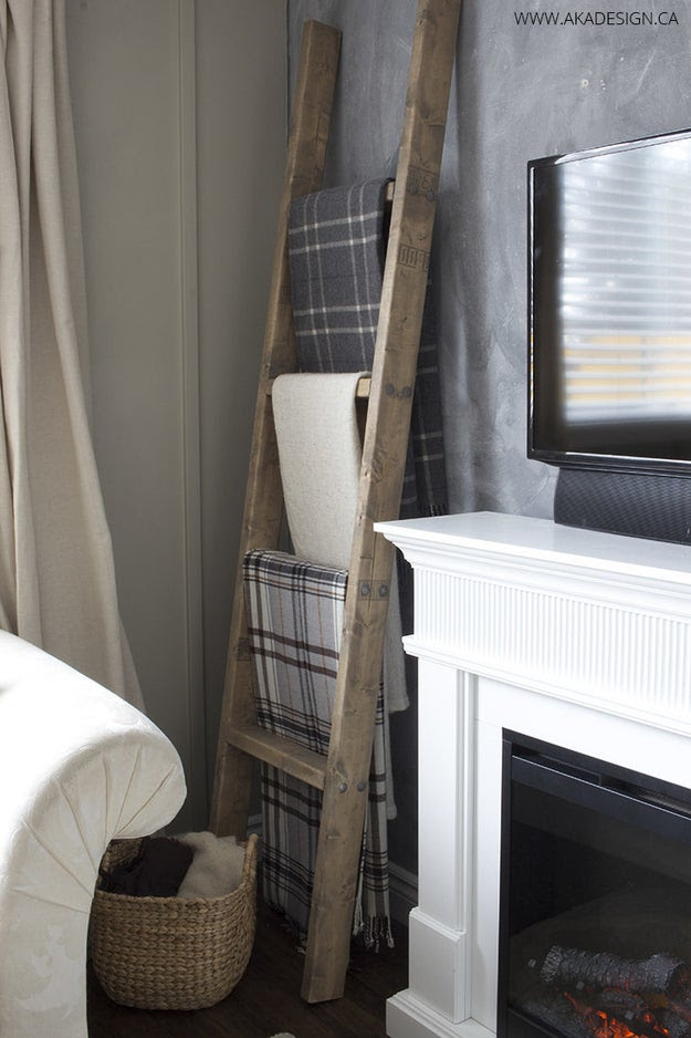 Make a ladder display for your favorite throws and blankets (for less than $25, too).