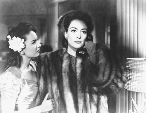 Feb. 1, 2011<br />27. Mildred Pierce (1945)<br />Starring Joan Crawford, Jack Carson, Zachary Scott, Eve Arden, Ann Blyth, Bruce Bennett, Lee Patrick<br />Directed by Michael Curtiz<br />Plot: &#8220;After her cheating husband leaves her, Mildred Pierce proves she can become independent and successful, but can&#8217;t win the approval of her spoiled daughter.&#8221;<br />This was an interesting movie. The blending of noir and melodrama was nicely done, and I was surprised at some of the twists in the plot&#8212;especially near the end. The use of flash-backs was compelling and the lighting and shadows accentuated the different moods of the story. I also thought the acting was top-notch and contained some very memorable characters. This was a very entertaining and well-done movie. If you haven&#8217;t seen it already, I recommend checking it out.