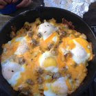 [homemade] cast iron skillet bacon potato hash cheesy eggs