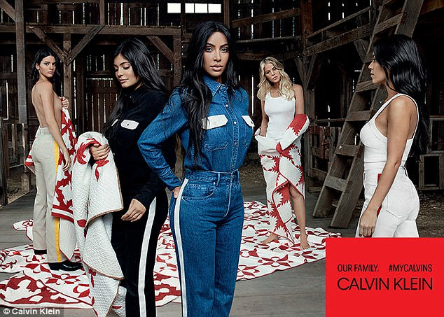 Taking risks: Kendall left) also stripped off and covered her modesty with a blanket, while pregnant Kylie hid her bump (second from left) - Khloe's bump was barely visible at the time