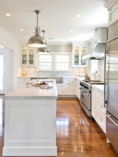 I am selling this flatiron desk that was bought from restoration hardware a few years ago,. White KItchen Cabinets with Stainless Steel Appliances