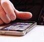 Communications, Telephone, Mobile, Man using Apple iPhone apps.