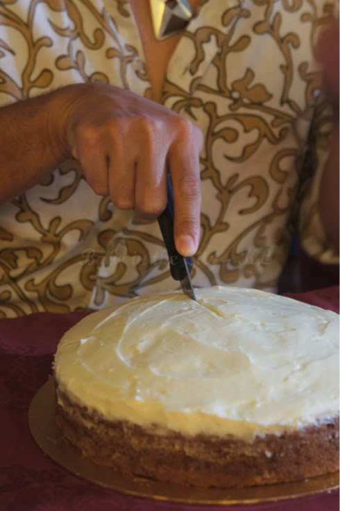 Master baker cutting cake