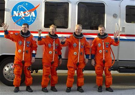 Space shuttle Atlantis STS-135 crew (L to R) mission specialist Rex Walheim, mission specialist Sandra Magnus, pilot Douglas Hurley and commander Christopher Ferguson depart crew quarters for launch pad 39A during the Terminal Countdown Demonstration Test at the Kennedy Space Center in Cape Canaveral, June 23, 2011. REUTERS/Scott Audette