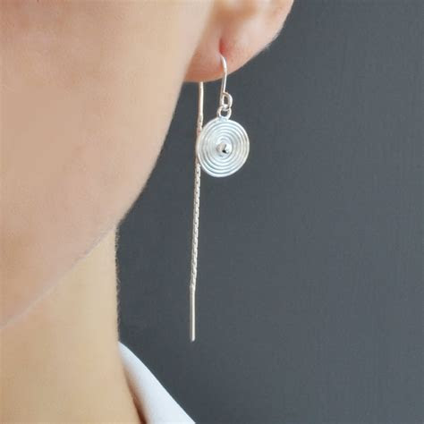 The brits standardized what it means for an item to be sterling silver way back in 14th century. Silver Spiral Pull Through Chain Earrings By Martha