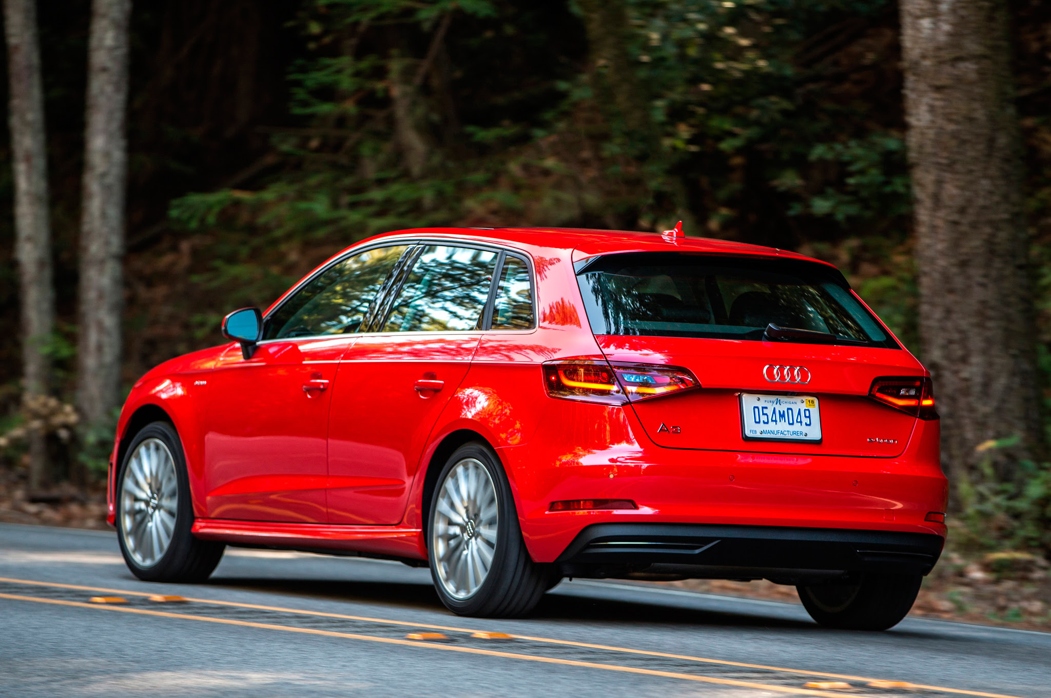 2016 Audi A3 e Tron rear three quarter in motion 03