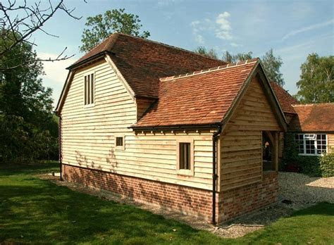 oak framed garages exposed brick contrast