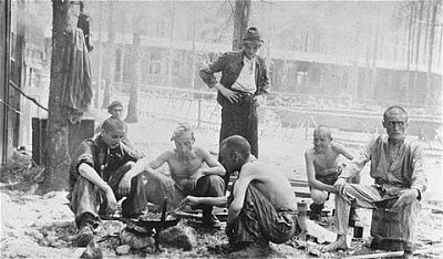 wwi-holocaust-ebensee-survivors-ebensee-cook-meal-over-open-fire.jpg