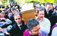 Dev Anand’s son Suneil (L) and Sahara India chairman Subroto Roy carry his casket at the Putney Vale Crematorium in London on Saturday. The legend’s ashes would be flown back to Mumbai.
