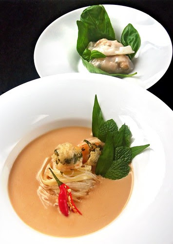 Fragrant Almond Laksa with noodles, fresh herbs, Oriental garden crispy prawns and southern Italian Har Gao dumplings