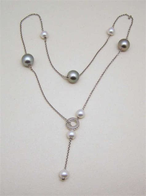 Mayfair estate & antique jewelry. MIKIMOTO Pearls in Motion 18k Diamond Clasp Necklace