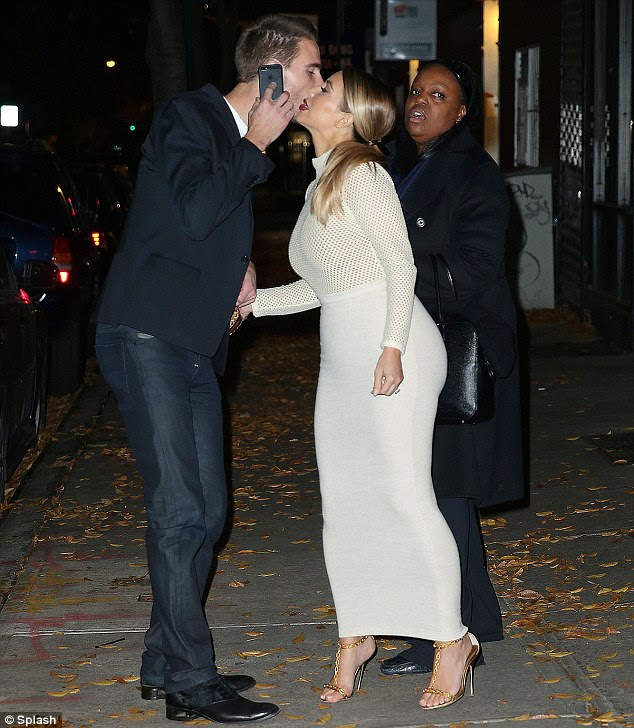 Mwah, sweetie: Kim Kardashian says goodbye to 'PR prince' Simon Huck who was also in attendance for the night out 