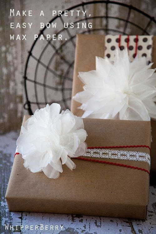 Dress up a brown box with a wax paper bow-snowball-fluffy-thing: | 24 Cute And Incredibly Useful Gift Wrap DIYs http://whipperberry.com/2011/12/holiday-memories-with-elmers-gluenglitter-wax-paper-bow-tutorial-giveaway.html