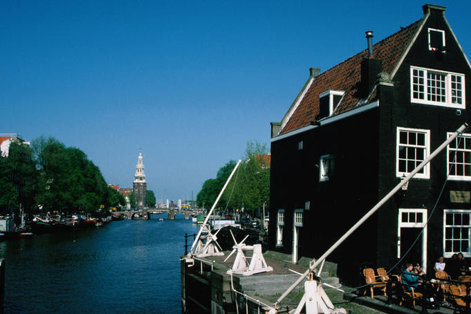 The Prinsengracht canal, leading to the 85 meter tower of the Westerkurk.