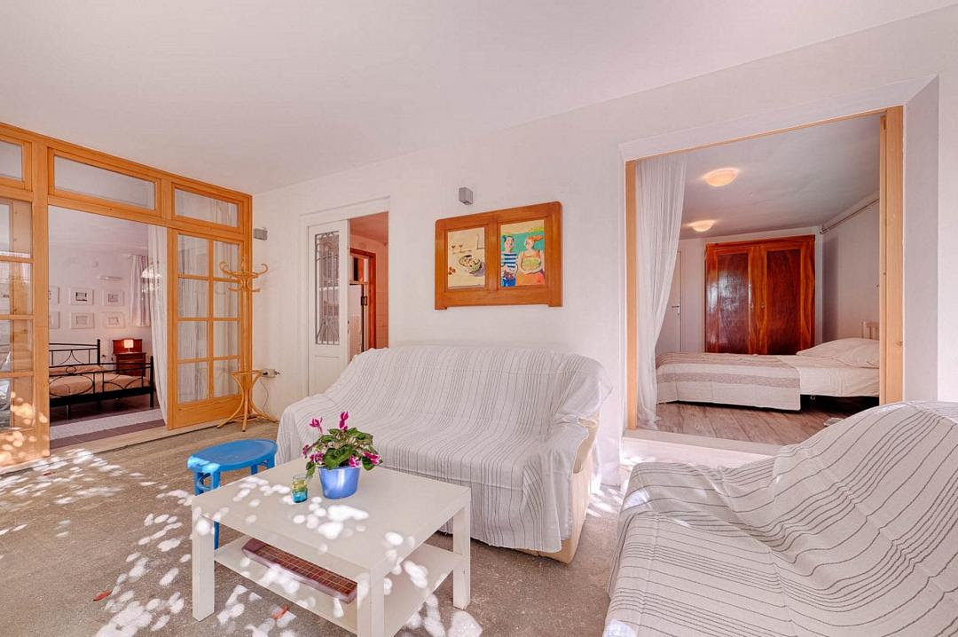 Porch, in the background there is the entrance into a bedroom