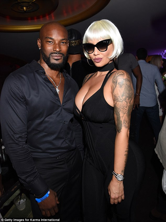 Mingling: Amber cosied up to male model Tyson