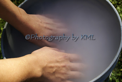 hands in a bucket of dry ice