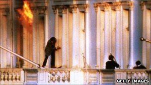 A hostage scrambles to safety