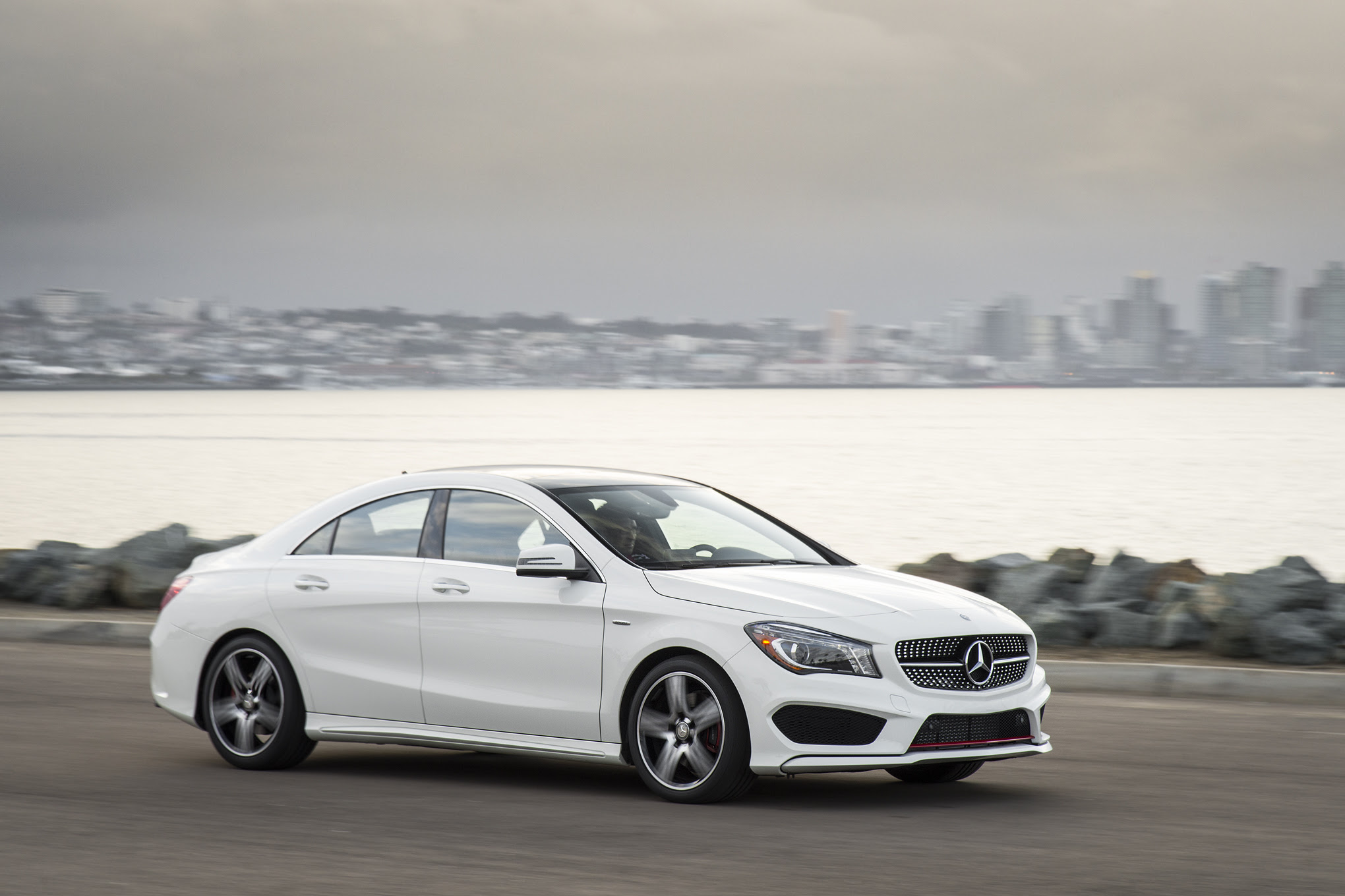 2015 Mercedes Benz CLA250 4Matic side in motion 03