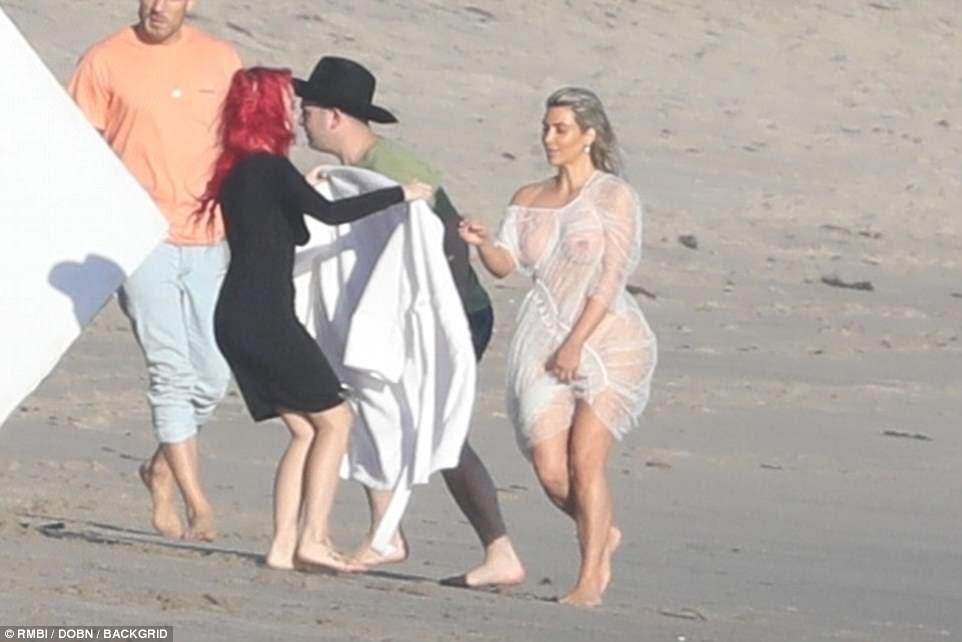 Kim Kardashian shows off her nipples in?see-through outfit for beach photoshoot (photos)